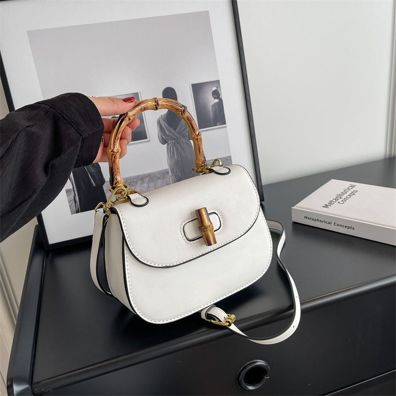 Handheld bamboo bag women's shoulder bag retro saddle bag.