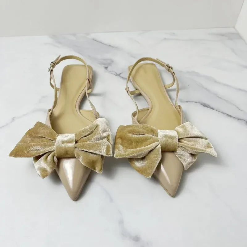 Light beige bow embellished exposed heel flat shoes
