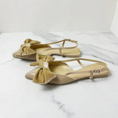 Light beige bow embellished exposed heel flat shoes