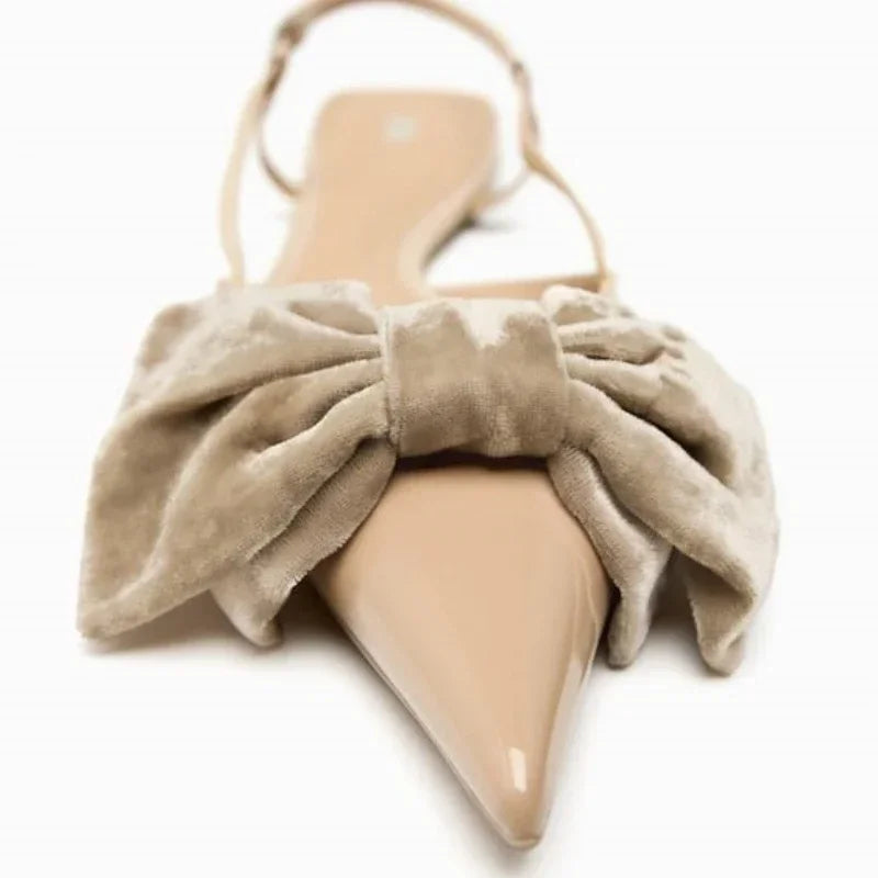 Light beige bow embellished exposed heel flat shoes