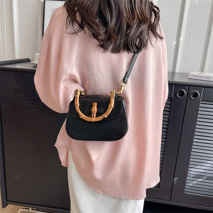 Handheld bamboo bag women's shoulder bag retro saddle bag.