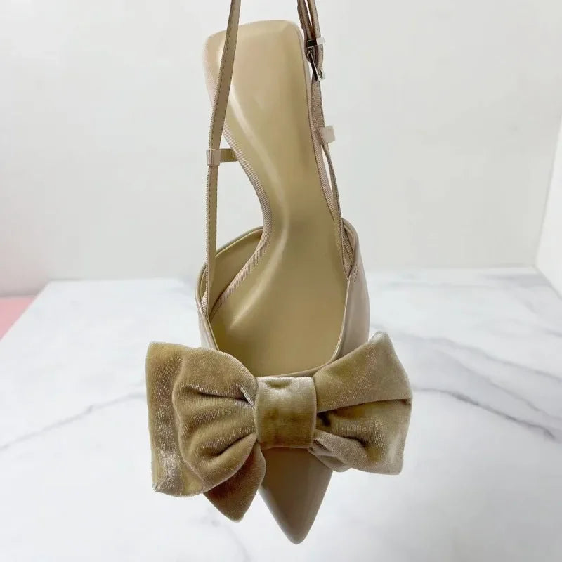 Light beige bow embellished exposed heel flat shoes